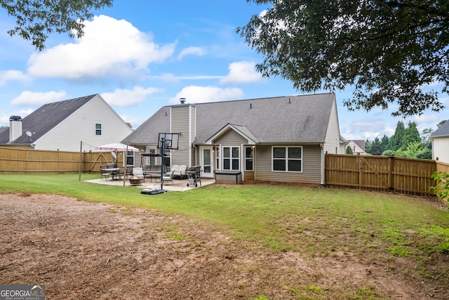 5511 Preserve Pt, Flowery Branch, GA 30542 - back of property featuring a patio area, a fenced backyard, a chimney, and a shingled roof