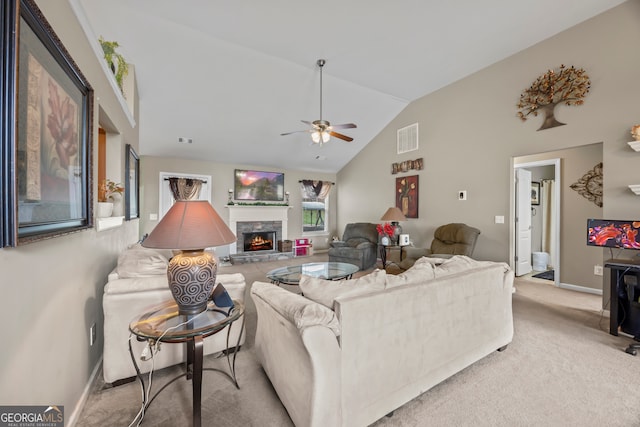 5511 Preserve Pt, Flowery Branch, GA 30542 - carpeted living room with a stone fireplace, a ceiling fan, and high vaulted ceiling