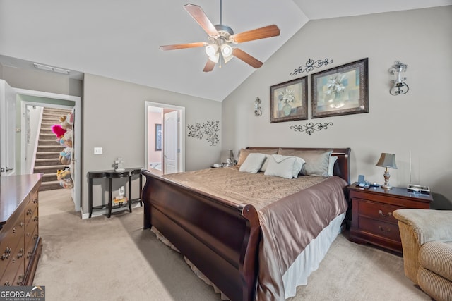 5511 Preserve Pt, Flowery Branch, GA 30542 - bedroom featuring vaulted ceiling, light colored carpet, ensuite bath, and a ceiling fan