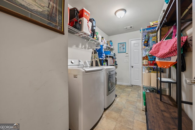 5511 Preserve Pt, Flowery Branch, GA 30542 - laundry room with separate washer and dryer and stone finish flooring