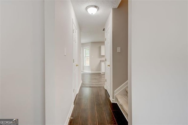 7006 Mahonia Pl, Lithonia, GA 30038 - corridor featuring dark wood-style flooring and baseboards