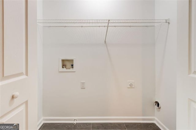 7006 Mahonia Pl, Lithonia, GA 30038 - laundry room with washer hookup, baseboards, electric dryer hookup, and dark tile patterned floors