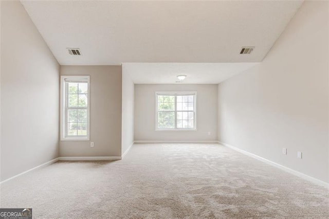 7006 Mahonia Pl, Lithonia, GA 30038 - carpeted empty room with baseboards