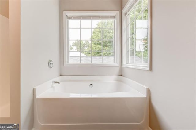 7006 Mahonia Pl, Lithonia, GA 30038 - bathroom featuring a garden tub