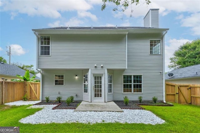 7006 Mahonia Pl, Lithonia, GA 30038 - back of property featuring a gate, a patio area, and a chimney