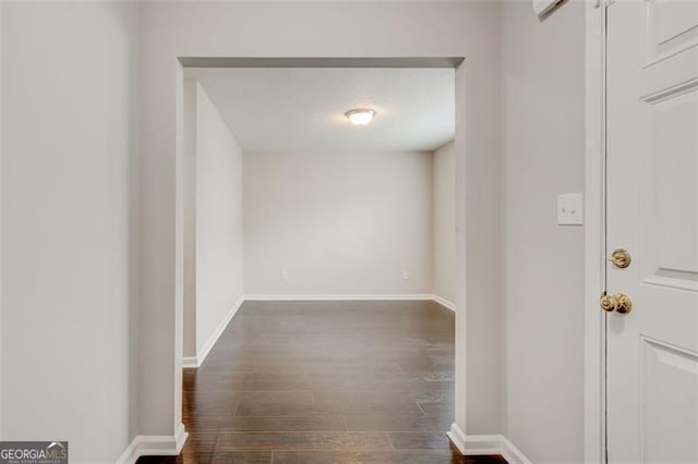 7006 Mahonia Pl, Lithonia, GA 30038 - hallway with dark wood-style floors and baseboards