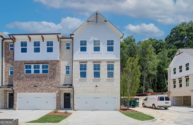 586 Avondale Park Cir Unit 51, Decatur, GA 30032 - view of front of property featuring concrete driveway, a garage, and brick siding