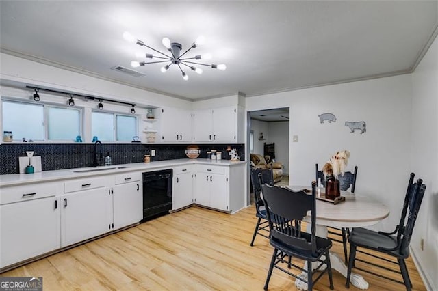 394 Knight Rd, Rockmart, GA 30153 - kitchen with dishwasher, a sink, a chandelier, light countertops, and decorative backsplash