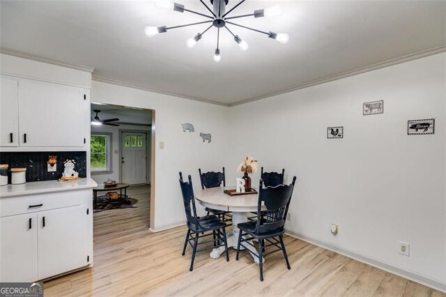 394 Knight Rd, Rockmart, GA 30153 - dining area with ornamental molding, light wood-type flooring, and a chandelier