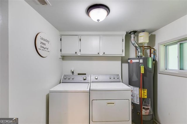 394 Knight Rd, Rockmart, GA 30153 - laundry area with gas water heater, independent washer and dryer, and cabinet space