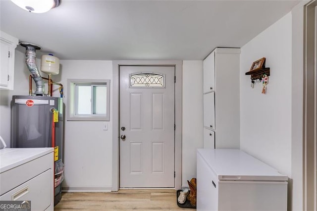 394 Knight Rd, Rockmart, GA 30153 - entryway with light wood-style floors, washing machine and dryer, and water heater
