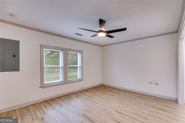 394 Knight Rd, Rockmart, GA 30153 - spare room with electric panel, light wood-type flooring, a ceiling fan, crown molding, and baseboards