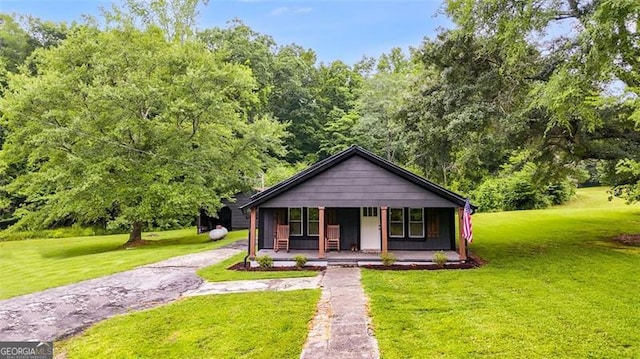 394 Knight Rd, Rockmart, GA 30153 - bungalow-style house featuring a porch and a front lawn