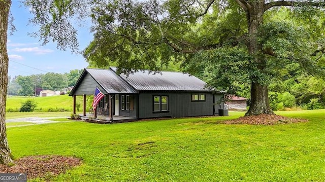 394 Knight Rd, Rockmart, GA 30153 - back of property with a lawn, metal roof, a porch, and central AC unit