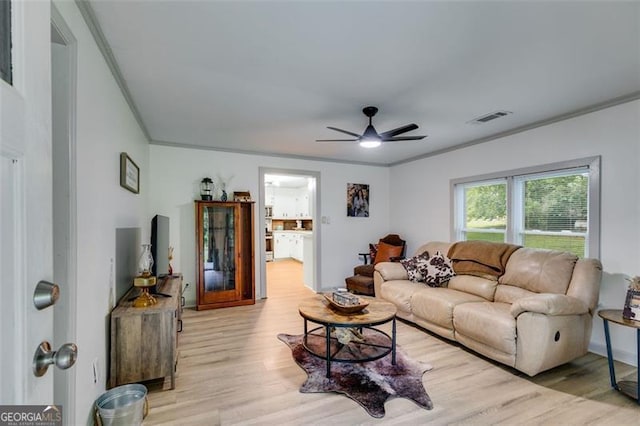 394 Knight Rd, Rockmart, GA 30153 - living area featuring ornamental molding, light wood-type flooring, and a ceiling fan