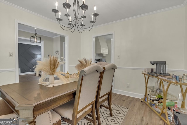2715 N Doublegate Dr, Albany, GA 31721 - dining room with ornamental molding, wood finished floors, and a chandelier