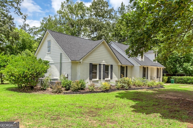 2715 N Doublegate Dr, Albany, GA 31721 - view of front of property with a shingled roof, brick siding, and a front lawn