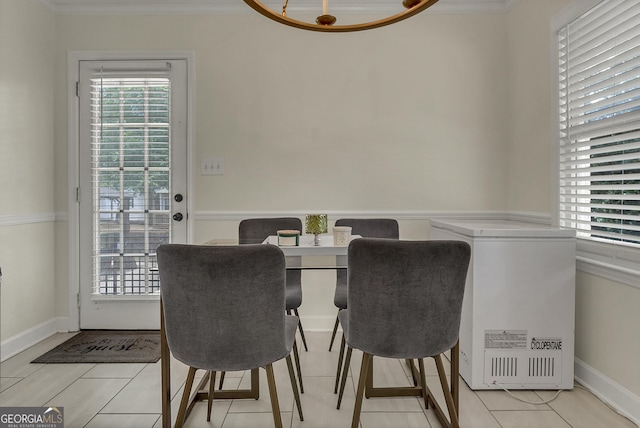 2715 N Doublegate Dr, Albany, GA 31721 - dining area featuring healthy amount of natural light, ornamental molding, and light tile patterned floors