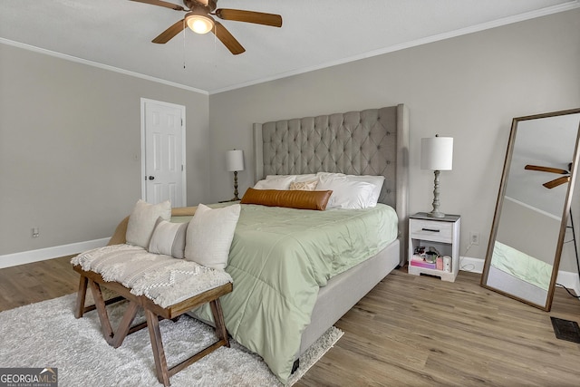 2715 N Doublegate Dr, Albany, GA 31721 - bedroom with wood finished floors, ornamental molding, and a ceiling fan