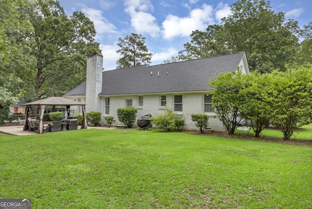2715 N Doublegate Dr, Albany, GA 31721 - back of property featuring a gazebo, a shingled roof, a patio, and a lawn