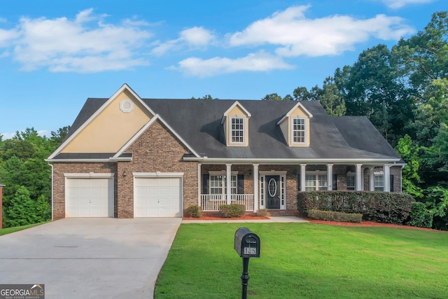 185 Stewart Glen Dr, Covington, GA 30014 - view of front facade featuring concrete driveway, brick siding, covered porch, and a front yard