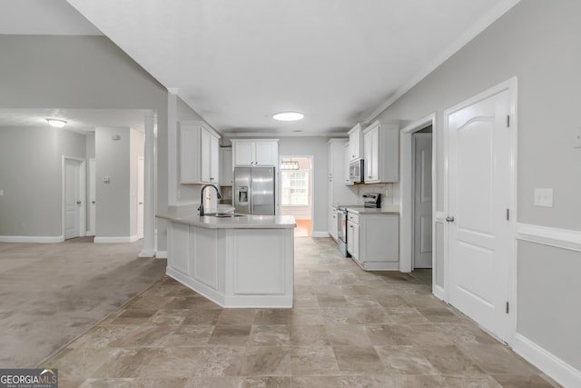 185 Stewart Glen Dr, Covington, GA 30014 - kitchen with appliances with stainless steel finishes, a sink, a peninsula, light countertops, and baseboards