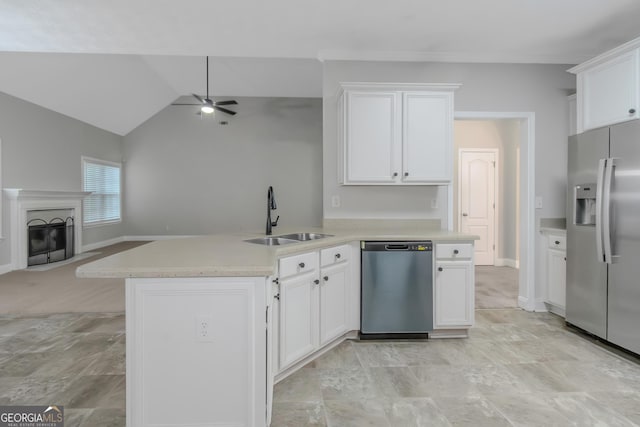185 Stewart Glen Dr, Covington, GA 30014 - kitchen with appliances with stainless steel finishes, a sink, open floor plan, ceiling fan, and white cabinetry