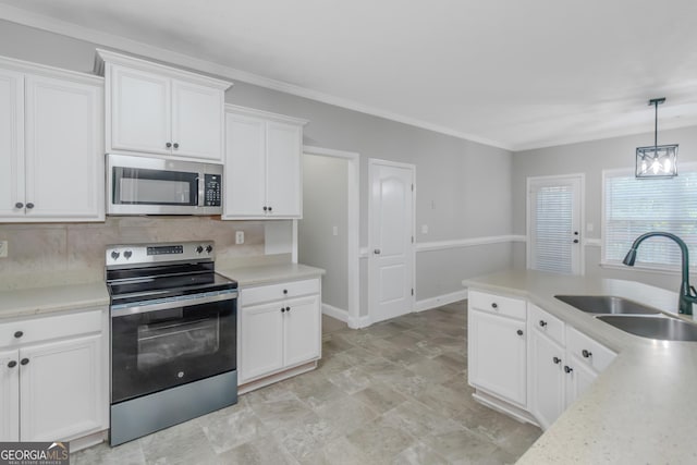 185 Stewart Glen Dr, Covington, GA 30014 - kitchen with stainless steel appliances, a sink, white cabinets, tasteful backsplash, and light countertops