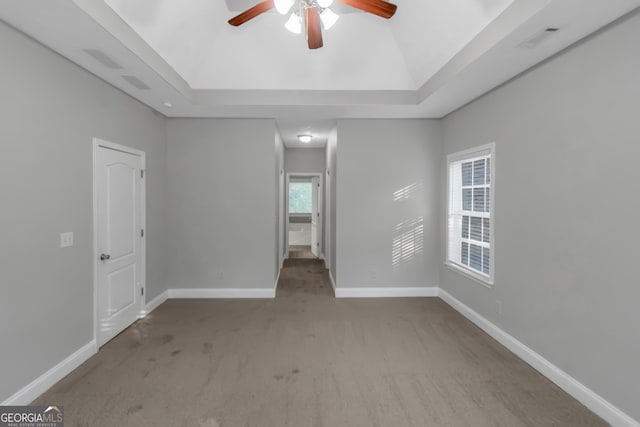 185 Stewart Glen Dr, Covington, GA 30014 - unfurnished room with a ceiling fan, carpet flooring, a tray ceiling, and baseboards