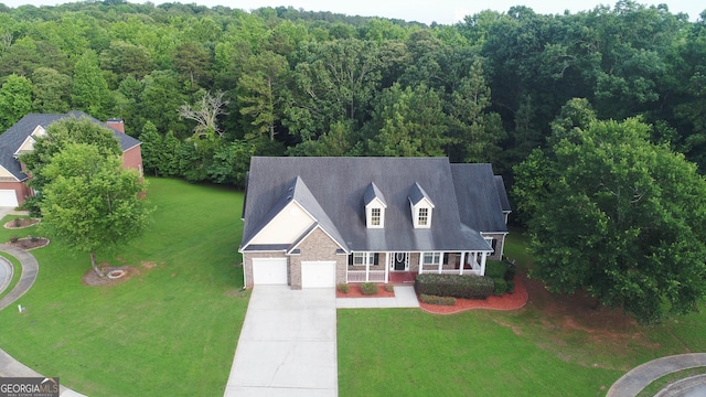 185 Stewart Glen Dr, Covington, GA 30014 - view from above of property with a heavily wooded area