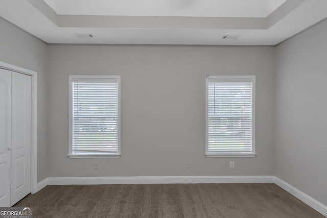 185 Stewart Glen Dr, Covington, GA 30014 - empty room featuring dark carpet and baseboards