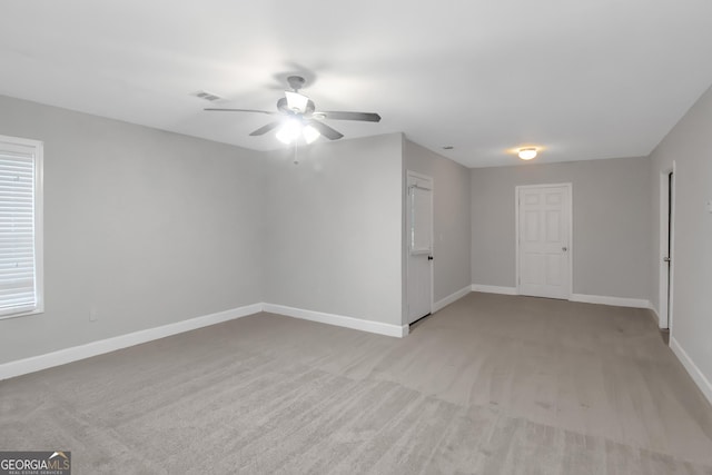 185 Stewart Glen Dr, Covington, GA 30014 - unfurnished room with a ceiling fan, baseboards, and light colored carpet