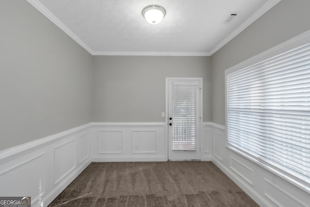 185 Stewart Glen Dr, Covington, GA 30014 - spare room with wainscoting, crown molding, carpet floors, a decorative wall, and a textured ceiling