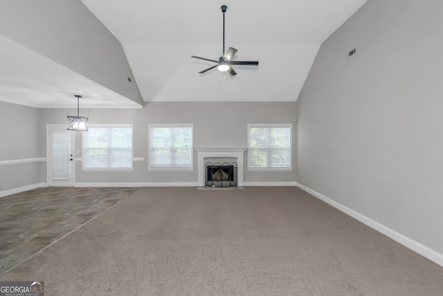 185 Stewart Glen Dr, Covington, GA 30014 - unfurnished living room with a ceiling fan, vaulted ceiling, a fireplace, and baseboards