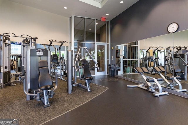 1080 Peachtree St NE Unit 2116, Atlanta, GA 30309 - workout area featuring a high ceiling and recessed lighting