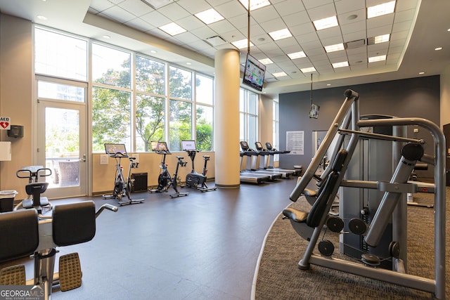 1080 Peachtree St NE Unit 2116, Atlanta, GA 30309 - exercise room with a high ceiling, a paneled ceiling, and healthy amount of natural light
