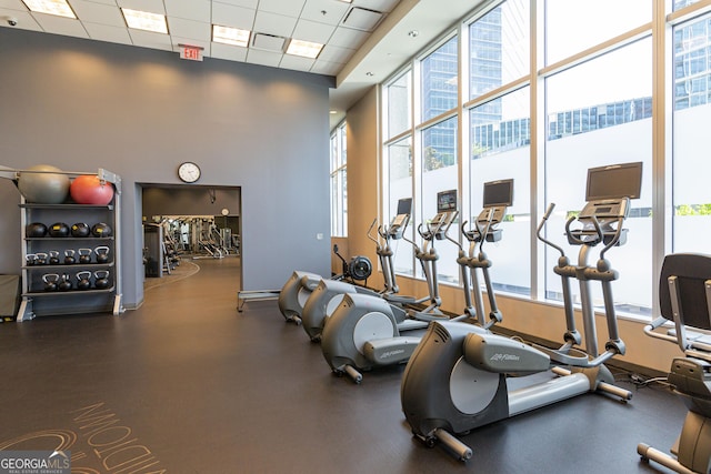 1080 Peachtree St NE Unit 2116, Atlanta, GA 30309 - workout area featuring a paneled ceiling and a towering ceiling