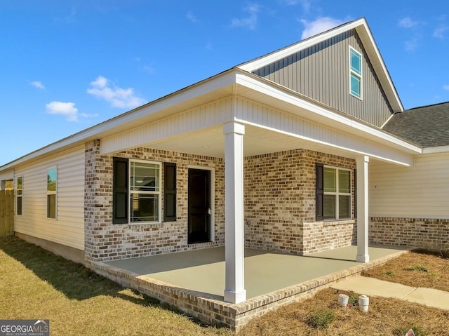 204 Eric Cv, Byron, GA 31008 - view of side of property with brick siding and a patio area