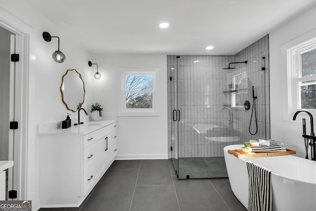 1536 Daffodil Dr, Marietta, GA 30062 - bathroom with vanity, a stall shower, a soaking tub, tile patterned floors, and baseboards