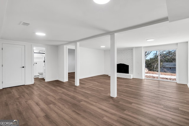 1536 Daffodil Dr, Marietta, GA 30062 - basement featuring dark wood-type flooring, baseboards, a fireplace, and recessed lighting