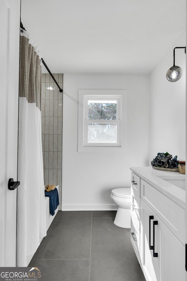 1536 Daffodil Dr, Marietta, GA 30062 - full bathroom featuring vanity, toilet, shower / bath combination with curtain, finished concrete flooring, and baseboards