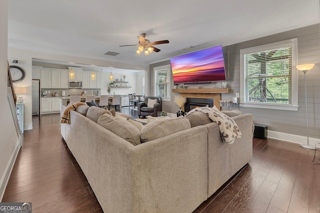 406 Fernstone Dr, Canton, GA 30114 - living room featuring baseboards, a fireplace, dark wood-style flooring, ceiling fan, and crown molding