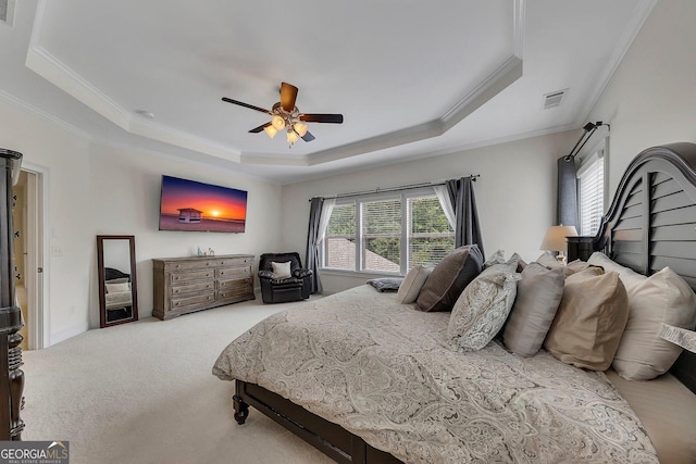 406 Fernstone Dr, Canton, GA 30114 - carpeted bedroom featuring a tray ceiling, ornamental molding, and a ceiling fan