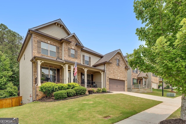 406 Fernstone Dr, Canton, GA 30114 - craftsman house with covered porch, a garage, a front lawn, and driveway