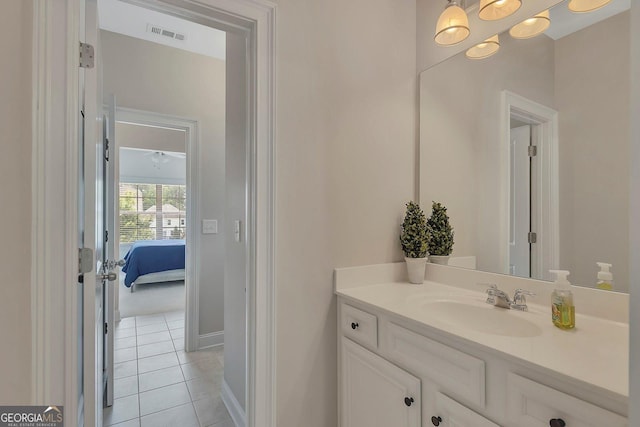 406 Fernstone Dr, Canton, GA 30114 - bathroom with vanity, tile patterned floors, ensuite bathroom, and baseboards