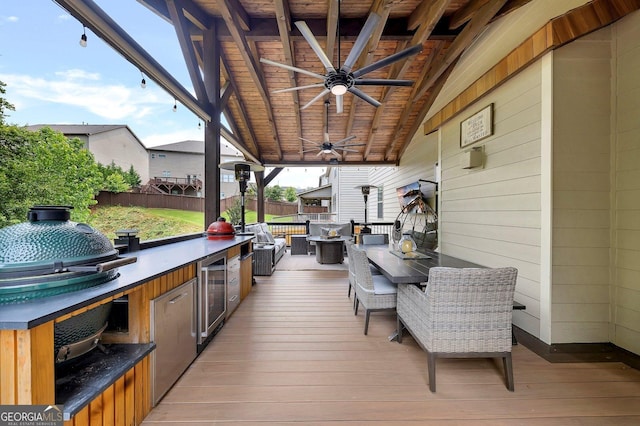 406 Fernstone Dr, Canton, GA 30114 - deck featuring wine cooler, a ceiling fan, outdoor dining area, and exterior kitchen