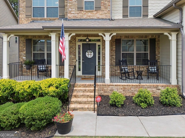 406 Fernstone Dr, Canton, GA 30114 - doorway to property featuring covered porch and brick siding