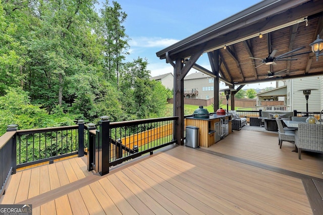 406 Fernstone Dr, Canton, GA 30114 - wooden terrace featuring exterior kitchen, ceiling fan, and outdoor dining area