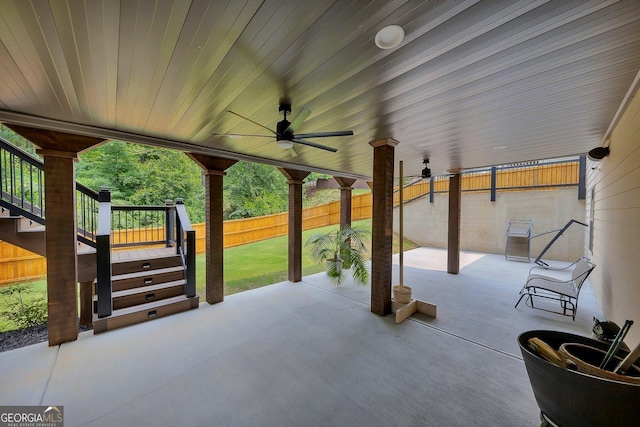 406 Fernstone Dr, Canton, GA 30114 - fenced backyard featuring a patio area, stairs, and ceiling fan