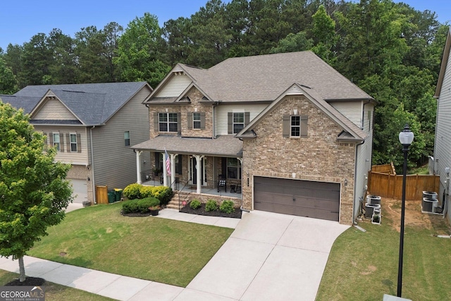 406 Fernstone Dr, Canton, GA 30114 - craftsman house with a porch, a garage, concrete driveway, cooling unit, and a shingled roof